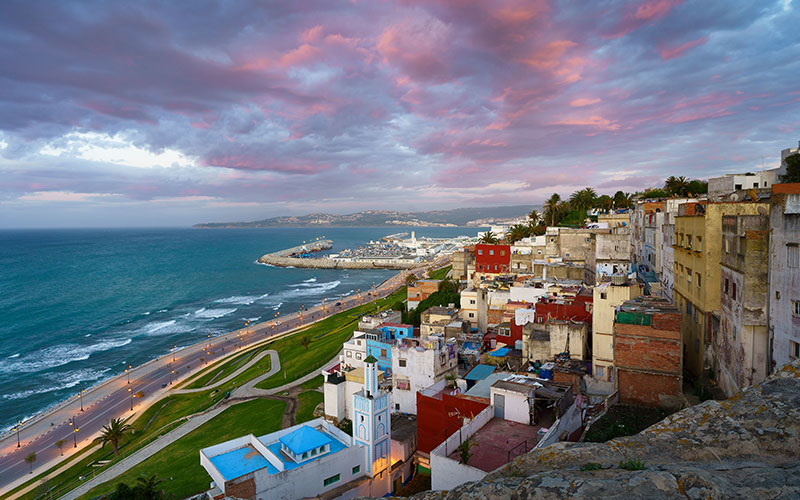 Aerial view of cityscape Tangier surrounded by buildings and water
