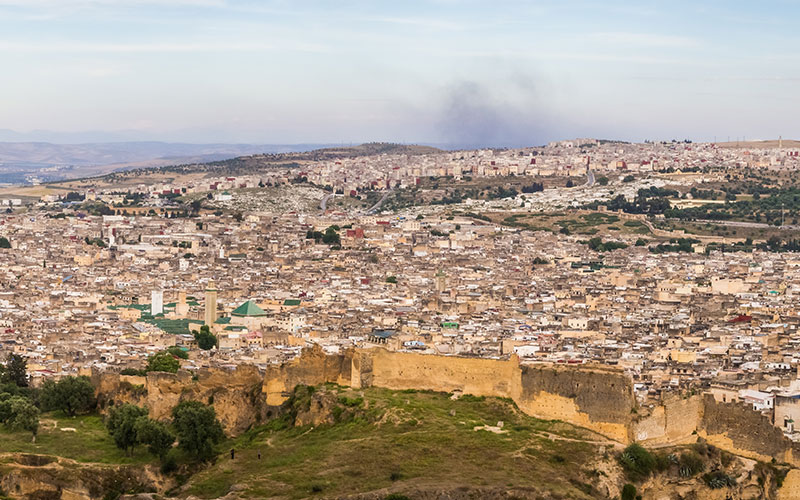 Panoramic high angle view of the old Fez city in Morocco under the cloudy sky
